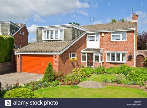 Download this stock image: A typical early 1980's style UK 5 bedroom detached house and integral garage with a well tended front garden on a sunny day. - B26EG2 from Alamy's library of millions of high resolution stock photos, illustrations and vectors. 80s House Exterior, 1980s House, 50s House, House Exterior Uk, Typical British, 1980's Style, 80s House, Field House, Brick Paving