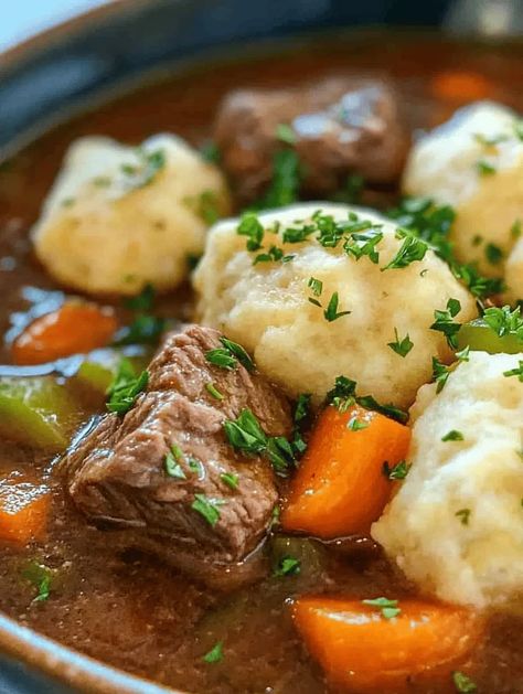 Imagine a warm bowl of Hearty Beef Stew filled with tender chunks of beef enveloped by a rich, aromatic broth, paired perfectly with fluffy dumplings that soak up every drop of flavor. This classic dish is not just a meal; it's an experience that evokes feelings of home and comfort. Often prepared during cold winter nights or special family gatherings, this recipe has a way of bringing everyone together around the dinner table. Beef Stew With Cheddar Biscuits, Easy Beef Stew With Dumplings, Leftover Beef Stew What To Do With, Beef Chunks Recipe, Stew Dumplings Recipe Simple, Beef Stew Dumplings Recipe, Recipes With Beef Stock, Recipes With Beef Chunks, Dumplings For Beef Stew