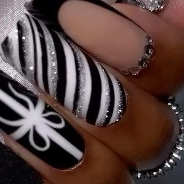 #1 HIGHEST QUALITY PRESS ON NAILS on Instagram: "Let’s welcome: Blk Candy Cane 🖤 - Christmas nails but in black!😮‍💨🖤…. Question? Who likes wearing Christmas nails? 🎁 this has been a debate.😮‍💨 - 🖤 Size shown L- L Square 🖤 M & L Lengths available 🖤 Available Now 🖤 RINGS: @iiceheaven 🔥🔥🙌🏽🖤 - - - Website link in bio.🖤 - #christmasnails2023 #nailsofinstagram #blackchristmas #blackchristmasnails #lnails #blackpressonnails #christmaspressonnails #queengawayacollection #queengawaya" Holiday Nails Black And White, Black And White Xmas Nails, Black Candy Cane Nails, White And Black Christmas Nails, Red Black Christmas Nails, Black White Christmas Nails, Black And Silver Christmas Nails, Christmas Nails Black And White, Alt Christmas Nails