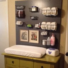 My daughter insisted on using peg board in her son's  nursery. I was dubious when she told me, but now I like it! Baby Nursery Organization, Changing Tables, Fun Nursery, Baby Sleep Problems, Nursery Organization, Baby Organization, Baby Bedroom, Baby Boy Rooms, Peg Board