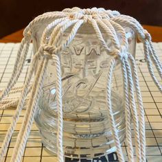 DIY Macrame Glass Jar Covers Made with Square Knots Jar Macrame Diy, Mason Jar Macrame Diy, Macrame Jar Hanger Diy, Macrame Jar Cover Diy Tutorial, Macrame Jars Diy, Rope Crafts Diy Ideas, Macrame Jar Cover Diy, Mason Jar Macrame, Macrame Bottle Cover