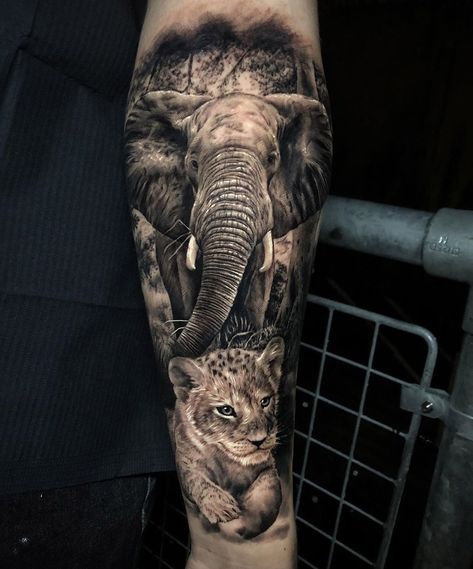 Elephant & Lion Cub by Ash Higham, an artist at Rapture Tattoo in Manchester, England. Teary Eye, Spiral Clock, Lion Cub Tattoo, Mandala Hip Tattoo, African Sleeve Tattoo, Clouds Lightning, Circus Tattoo, Jungle Tattoo, Africa Tattoos