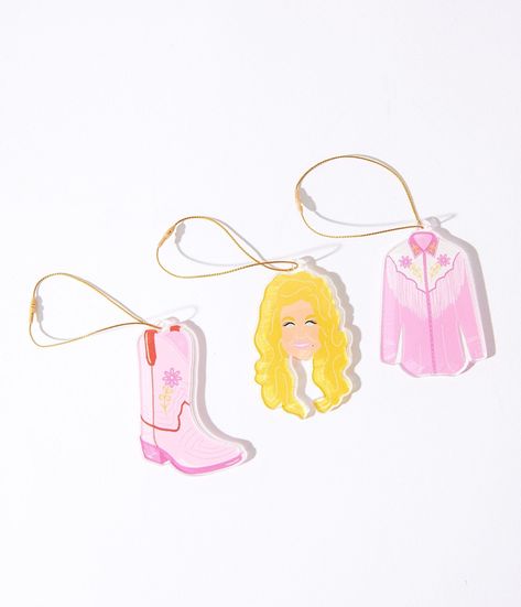 This extraordinary 3-pack acrylic ornament collection captures three legendary symbols that define Music City. First, you'll be enchanted by the glittering likeness of Dolly Parton, the queen of country music, whose charisma and talent have won hearts across the globe. Then, feast your eyes on a delightful pink cowboy boot ornament – an ode to cowboys and cowgirls who’ve left their mark in this sensational city. And don’t forget about our gorgeous pink western shirt ornament that pays homage to Pink Cowboy Boot, Boot Ornament, Pink Cowboy Boots, Pink Cowboy, Music City, Cowboy Boot, Cowboy And Cowgirl, Dolly Parton, Western Shirt