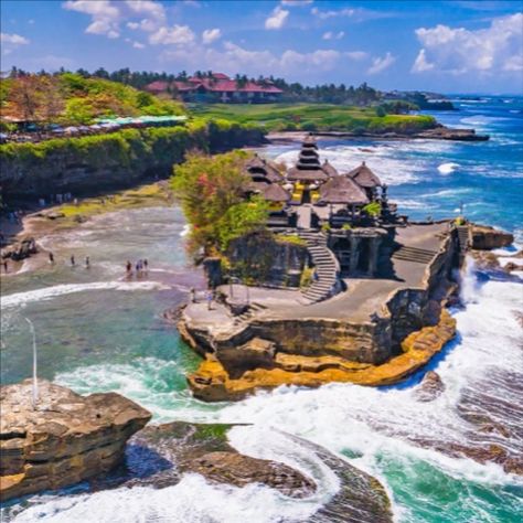 Canggu is full of colourful beachfront bars, surf ready waves, wholefood cafes, restaurants, cool homeware and fashion stores.  It's where rice field's meet volcanic black sand beaches and you don't have to compromise on dining and nightlife.   You will never want to leave !! Click on Affiliate Link for all of the details xx Tanah Lot Temple, Temple Bali, Uluwatu Temple, Voyage Bali, Mountain Camping, Bali Beaches, Bali Island, Honeymoon Packages, Denpasar