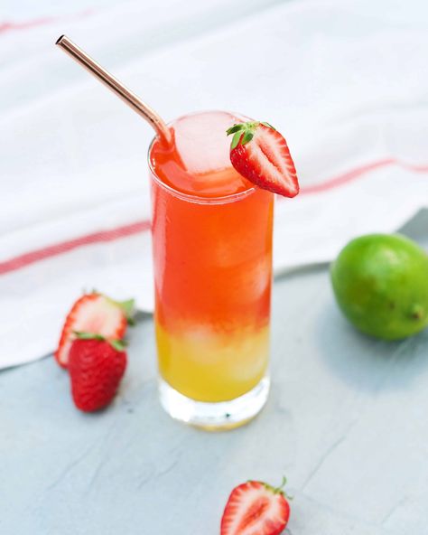 vodka cocktail for a tropical vacation with strawberries, mango juice and club soda. this ombre cocktail is such a refreshing summer alcoholic drink Hawaii Desserts, National Vodka Day, Mango Vodka, Mango Cocktail, Summertime Cocktail, Mango Drinks, Summer Drinks Alcohol, Vodka Cocktails Recipes, Vodka Cocktail