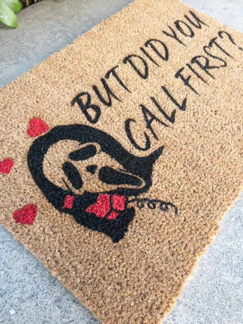 Ghostface Doormat | Scream Halloween Doormat Our mats are made of 100% natural coir material with PVC slip resistant rubber backing. Natural surface provides durability and traction to wipe your shoes. Suitable for indoor and outdoor use. All of our designs are hand-painted made with love just for you. But Did You Call First Door Mat, Witchy Welcome Mat, Ghost Welcome Mat, Halloween Mat Painting Ideas, Fall Rug Ideas, Cricut Halloween Door Mat, Spooky Door Mat Ideas, Cricut Halloween Decorations Outdoor, Diy Halloween Floor Mat