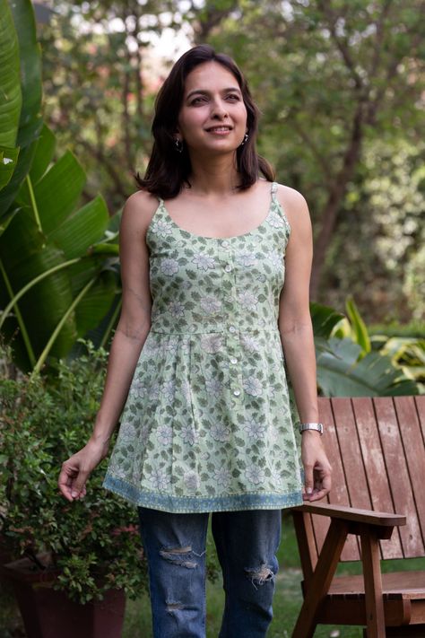 Introducing a beautiful cotton spaghetti top, featuring a handblock print in pista green with a floral jaal pattern. The top has a round neck and is sleeveless, making it perfect for warm weather. It also has a row of shell buttons in the front, adding a touch of elegance to the overall design. The lightweight fabric and comfortable fit make it a perfect choice for a day out with friends or a casual day at home. This top is sure to elevate any summer outfit with its refreshing color and charm... Pista Green, Spaghetti Top, Short Kurti, Shell Buttons, Cute Tops, Summer Outfit, Lightweight Fabric, Warm Weather, Business Casual