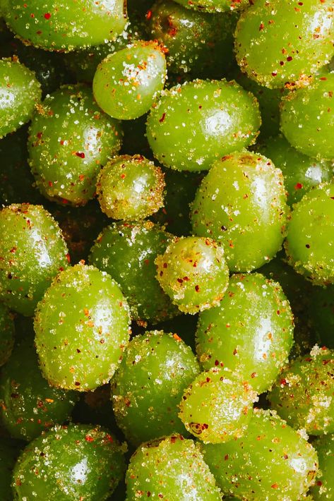 Introducing my latest snack obsession. My Frozen Tajin Grapes are a sweet and tangy snack that is perfect for the warmer months! Plus, this recipe uses only four simple ingredients, and comes together in the freezer in just a few hours, making it the perfect, pre-ahead snack to keep you cool, all summer long!A close-up image of the frozen Tajin grapes Frozen Grapes With Tajin, Grapes With Tajin, Frozen Fruits Aesthetic, Snack Ideas For Get Togethers, Frozen Tajin Grapes, Fun Snack Ideas For Adults, Tajin Gummy Bears Recipe, Snacks With Grapes, Fruit Based Meals