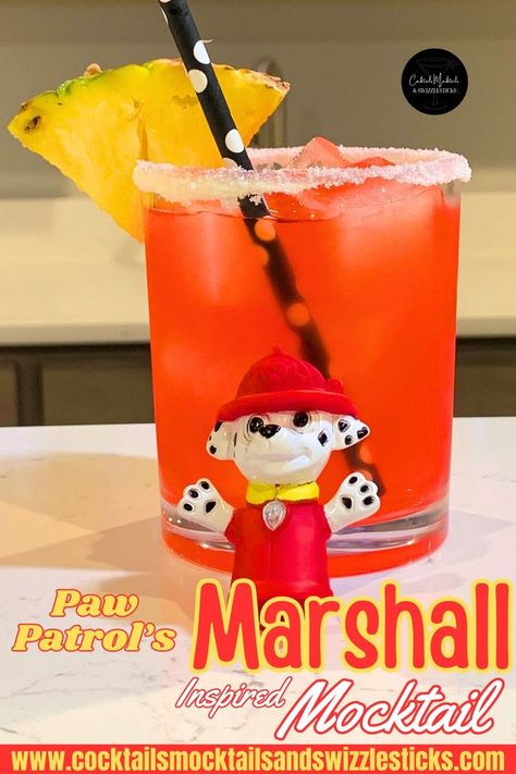 This image shows a red drink with a white rim with a yellow pineapple garnish and a black and white pokadot straw with marshall from that paw patrol figure in front. Paw Patrol Themed Birthday Party, Marshall Paw Patrol Birthday, Disney Inspired Cocktails, Mocktail Party, Movie Night Dinner, Movie Night Theme, Movie Night For Kids, Paw Patrol Movie, Disney Dinner