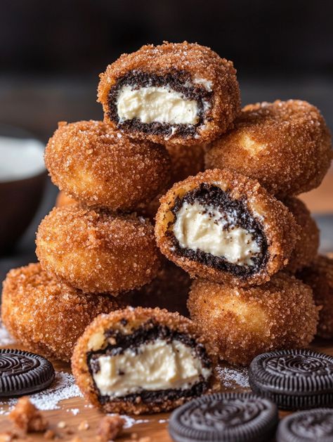 Cookies & Cream Cheesecake-Filled Deep-Fried Oreos 🍪  🍪 𝗖𝗵𝗲𝗲𝘀𝗲𝗰𝗮𝗸𝗲 𝗙𝗶𝗹𝗹𝗶𝗻𝗴 🍪 8 oz cream cheese, softened  1/2 cup granulated sugar  1/2 cup sour cream  1 tsp vanilla extract  1/2 cup crushed Oreo cookies  🍪 𝗢𝗿𝗲𝗼𝘀: 1 package of regular Oreos (or your favorite variety)  🥣 𝗕𝗮𝘁𝘁𝗲𝗿: 1 cup all-purpose flour  1/2 cup granulated sugar  1 tsp baking powder  1/4 tsp salt  1 large egg  1 cup milk  1 tsp vanilla extract   𝗙𝗿𝘆𝗶𝗻𝗴: Vegetable oil (for frying) Oreos Cheesecake, Fried Oreo, Deep Fried Oreos, Crushed Oreo, Baking Aesthetic, Cookies And Cream Cheesecake, Fried Oreos, Cream Cheesecake, Easter Snacks