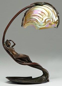 Art Nouveau Nautilus table lamp by C. Bonnefond, French, late 19th or early 20th century. An art nouveau lamp with a bronze base of a reclining nymph on a lily pad and an iridescent shade in the shape of a nautilus shell, base signed C. Bonnefond. Art Nouveau Lamp, Art Nouveau Arquitectura, Art Nouveau Lighting, Art Nouveau Lamps, Lampe Art Deco, Design Art Nouveau, Art Nouveau Furniture, Bijoux Art Nouveau, Art Nouveau Architecture