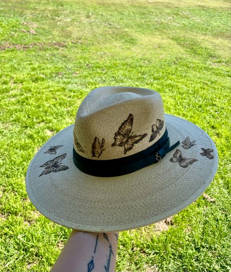 Pyrography hand burned butterfly straw hat Burned Hat Ideas, Burned Straw Hat, Wood Burning Hats, Pyrography Hats, Wood Burn Cowboy Hat, Pink Burned Hat, Hand Burnt Hats, Butterfly Burned Hat, Country Style Hand Painted Brimmed Hat