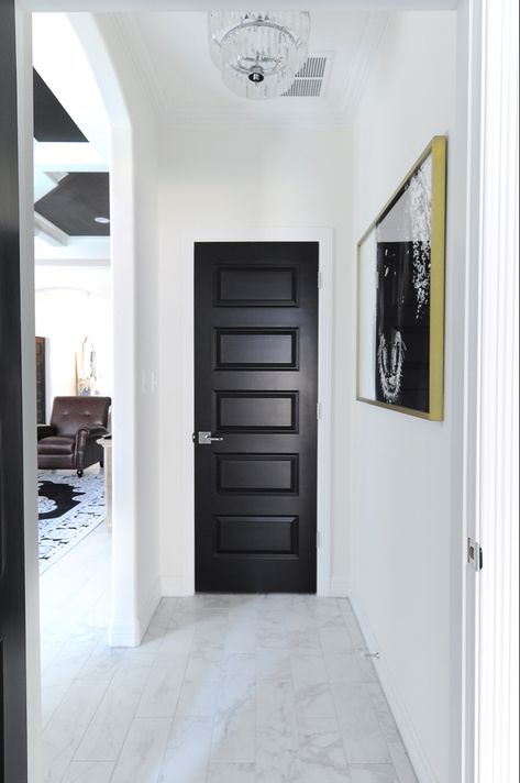 Black interior doors make a bold statement against white walls in this modern home with traditional touches. Dark Interior Doors, White Interior Doors, Dark Doors, Painted Interior Doors, Black Interior Doors, Interior Design Minimalist, Black And White Interior, Black Door, White Doors