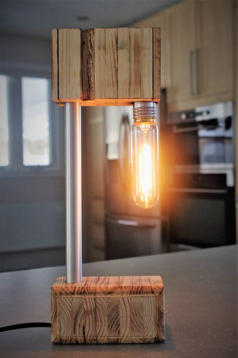 The Recycled Wooden Desk Lamp - Desk Lamps, Wood Lamps -   Unique and original design. Done by hand with recycled materials. Dimmer allows you to enjoy Edison light bulbs and choose the desired brightness; bright lighting or just a soft glow of candlelight. Lightly burnt and sanded wood. Stainless steel and aluminum insertion for a modern touch. Buy Now  #Concept #Design #Desklamp #Edison #Farmhouse #Handmade #Lightbulb #Modern #Recycled #Wood #Woodlamp Wooden Desk Lamp, Wooden Lamps Design, Best Desk Lamp, Wood Lamp Design, Driftwood Lamp, Lamp Makeover, Wood Lamp, Lampe Decoration, Cool Lamps