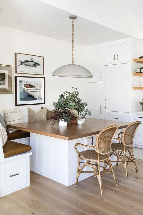 Cottage style L-shaped breakfast banquette and rattan and bamboo chairs sit at a square walnut top breakfast table illuminated by a gray dome chandelier. Booth Kitchen, Kitchen Booth, Booth Seating In Kitchen, Dining Booth, Pure Salt Interiors, Kitchen Breakfast Nooks, Pure Salt, Booth Seating, Kitchen Nook