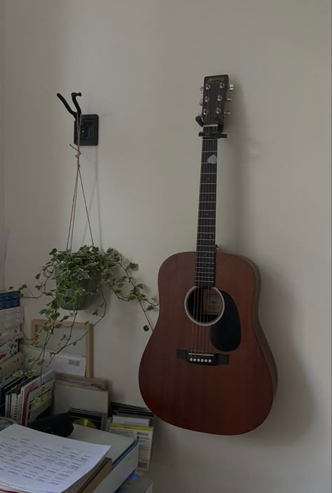 Guitar In Bedroom Aesthetic, Guitar On Wall Aesthetic, Guitar Stand Aesthetic, Guitar In Room Aesthetic, Hanging Guitars On Wall Ideas Bedroom, Bedroom With Instruments, Guitar Aesthetic Room, Hanging Guitars On Wall Ideas, Musician Room Aesthetic