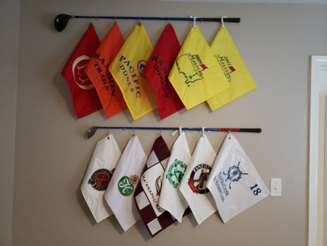 My husband wanted to display his golf flags collection and I came up with this idea to use some clubs he played with in college and tie his flags to it. We love how it turned out! Easy to make. Golf Themed Powder Room, Golf Flag Display Ideas, Golf Flag Display, Flag Display Ideas, Golf Bedroom, Golf Flags, Office Golf, Diy Golf, Golf Simulator Room