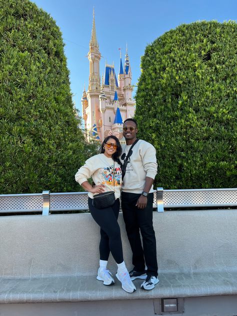 Couple in front of Disney castle in neutrals Disney Couple Outfits Winter, Disneyland Couple Outfits Winter, Disney Mom Outfit Winter, Disney Dad Outfits, Disney In November Outfits, Mom And Son Disney Outfits, Mom Disney Outfit Winter, Matching Disney Outfits Couples, Disney Couple Outfits Ideas