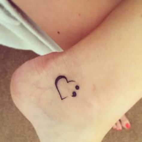 You can also place one near the heel of your foot. This one is a semicolon and a simple heart tattoo. Just says love your life because there are people who love you. Colon Tattoo, Simple Heart Tattoos, Semi Colon, Tattoo Trend, Semicolon Tattoo, Aesthetic Music, Shop Aesthetic, Tattoos For Daughters, Great Tattoos