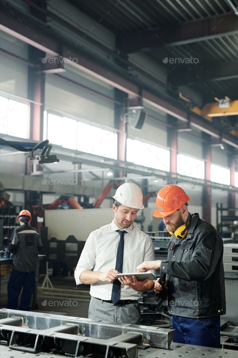 Engineering industrial machine by Pressmaster. Technician in formalwear using tablet while engineering industrial machine with factory worker in workshop #Sponsored #Pressmaster, #Technician, #machine, #Engineering Industrial Engineering Aesthetic, Engineering Photography, Engineering Industrial, Engineering Photos, Engineering Workshop, Project Engineer, Factory Photography, Job Pictures, Virtual Families