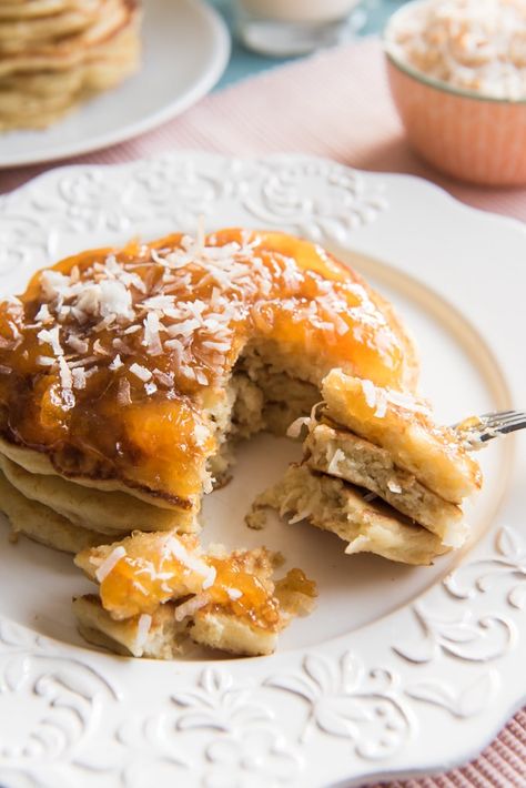 Toasted Coconut Pancakes are light, fluffy, and so easy to make that you don't need to save them just for weekends! Change up your breakfast routine with these yummy and unique pancakes. Made with coconut milk instead of buttermilk, with lots of toasted, sweetened coconut, your family is sure to love these delicious toasted coconut pancakes! French Fruit Tart Recipe, Creative Pancake Recipes, Thick Pancakes, Easy Fruit Tart, Savory Bread Recipes, Brunch Waffles, Savoury Pancakes, Showstopper Dessert, Weekend Recipe