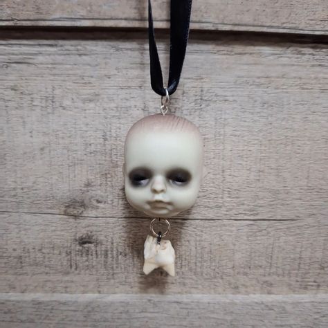 NFS Deceased baby doll necklace with deer tooth . . Might do a collection featuring doll parts...thoughts? . odd-moth.com . . #oddmoth #oddmothcraftandcurio #whimsigoth #smallbusiness #smallbusinessowner #shopsmallbusiness #supportsmallbusiness #cottagecore #darkcottagecore #darkacademia #crystaljewelry #bones #bonejewelry #entomology #entomologyart #fairycore #goblincore #witchyjewelry #vultureculture #odditiesdecor #oddities #odditiesjewelry #handmadenecklace #handmadejewelry #handmaderin... Moth Craft, Oddities Jewelry, Oddities Decor, Entomology Art, Bra Tips, Doll Necklace, Vulture Culture, Goblin Core, Dark Cottagecore