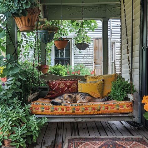 Cozy porch scene with sleeping cat on multicolored bench surrounded by greenery and rustic elements Maximalist Screened In Porch, Reading Porch, Porch Daybed, Cute Porch, Bohemian Porch, Porch Vibes, Front Entry Decor, Cushioned Bench, Dream Porch