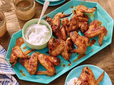 Get Grilled Chicken Wings with Spicy Chipotle Hot Sauce and Blue Cheese-Yogurt Dipping Sauce Recipe from Food Network Chipotle Hot Sauce, Yogurt Dipping Sauce, Foil Pack Dinners, Foil Pack Meals, Sweet And Spicy Chicken, Bbq Dishes, Grilled Chicken Wings, Dove Chocolate, Dipping Sauces Recipes