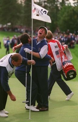 In 1995, the U.S. looked like a lock to win the Ryder Cup as they were up two points entering the Sunday singles matches. After a great comeback by the Europeans, it all came down to the last match between Philip Walton and Jay Haas. On the 18th, Jay three-putted from the fringe for a double-bogey and Philip Walton two-putted for bogey and the Ryder Cup victory. Europe serenaded by singing "Philip Walton, we love you!" Pro Golfers, Great Comebacks, Ryder Cup, Putt Putt, Golfers, Games To Play, Victorious, Soccer Field, Jay