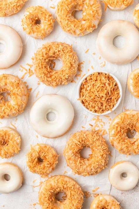 These baked toasted coconut donuts are soft, moist and topped with a light coconut glaze and shredded toasted coconut! They're the perfect weekend breakfast treat or simple dessert for the coconut lover in your life! Coconut Donut Recipe, Toasted Coconut Cake, Coconut Glaze, Christmas Cookie Recipes Holiday, Coconut Baking, Homemade Donuts Recipe, Baked Donut Recipes, Coconut Syrup, Coconut Oil Recipes