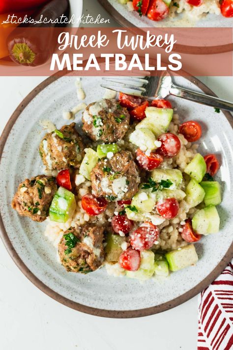 Greek Turkey Meatball Bowls feature oven-baked herby feta and spinach filled turkey meatballs, cucumber and tomato salad, and creamy Greek vinaigrette over buttery couscous.  Light, delicious, and perfect for meal prep or a quick and easy weeknight dinner. #turkeymeatballs #greekturkeymeatballs #meatballs #healthymeatballs Greek Meatball Meal Prep, Greek Turkey Meatballs With Tzatziki, Greek Turkey Meatballs With Spinach And Feta, Healthy Greek Turkey Meatballs With Tzatziki, Turkey Sausage Meatballs, Greek Turkey Meatballs, Greek Turkey, Ground Turkey Meatballs, Healthy Meatballs