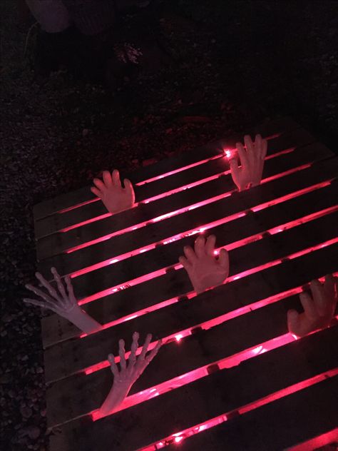 Our hands from hell. Halloween Dungeon Decor, Dungeon Decorations Halloween, Dungeon Halloween Decorations, Dungeon Halloween, Haunted House Inside, Halloween Dungeon, Pallet Halloween, Red Christmas Lights, Cute Halloween Decorations