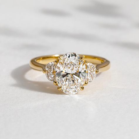 MOONLIGHT Oval cut diamond Half moon side diamonds 1.90ct centre stone 18k Recycled gold 6 - 8 weeks to craft from order Ships worldwide Handmade in London ❤️ #ovalcut #ovalcutengagementring #ovalcutdiamond #halfmoondiamonds #londonjeweller #engaged #engagementring Large Cluster Engagement Ring, 3 Stone Cushion Cut Engagement Ring, Oval Art Deco Engagement Ring, 3 Stone Engagement Rings Oval, Oval Ring With Side Stones, 3 Stone Engagement Rings With Band, 3 Stone Oval Engagement Ring, Half Moon Side Stones, Three Stone Oval Engagement Ring