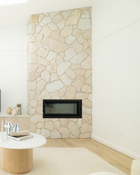 Another day, another gorgeous fireplace. With winter approaching we are all about these spaces!   Our stone creates the perfect focal point for your living space, and sets the warm tone for your indoor fireplace.   We have endless stone and wall cladding options in store, on display in our huge showroom - come and see for yourself. High Ceiling Tv Wall, House Finishes, Ceiling Tv, Gorgeous Fireplaces, Stone Chimney, Fireplace Tv Wall, Minimalist Living Room Design, Wall White, Stone Cladding