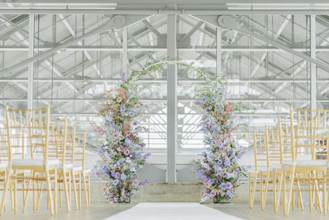 What is lilac and cream and pretty all over? This darling micro wedding in a spacious Vancouver loft. The minimalist wedding venue set the stage for a celebration focused on quality, not quantity, and with that came a gorgeously lush floral backdrop for the ceremony, a velvet lounge overlooking the dinner setup of vintage walnut desks-turned-dining tables and an overhead floral installation bursting with texture and dimensions. Pastel Wedding Ceremony, Lilac Wedding Themes, Lavender Wedding Theme, Romantic Wedding Ceremony, Lilac Wedding, Cream Wedding, North Vancouver, Theme Color, Pastel Wedding