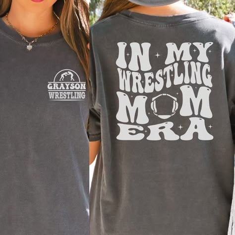 "Wrestling Mom Era Comfort Colors Shirt is the perfect gift for any wrestling mama this Christmas! Makes a great Mother's Day or Birthday Gift as well!  In the personalization box, enter the name you would like on your shirt. (Ex: Grayson) This shirt runs true to size.  If you want an oversized look, please order one size up.  If you want the oversized dress look, please size up two sizes. This is made with a 1717 Comfort Colors, garment-dyed t-shirt. Made with 100% ring-spun cotton, soft-washed Wrestling Mom Shirts, Youth Wrestling, Wrestling Gift, Sports Mom Gifts, Wrestling Mom, Wrestling Shirts, Mother Shirts, Mom Era, Weird Shirts