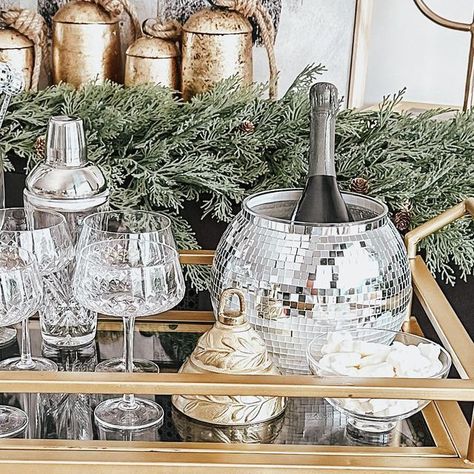 Jen Alvarez • Home Decor on Instagram: "New years bar cart 🪩 comment “LINK” to get the link to shop this post straight to your inbox Amazon has tons of last minute NYE bar cart decor whether you’re staying in or hosting 🥂 💫 including the cutest ice bucket disco ball 🪩! Shop on my @shop.ltk - link in bio - https://liketk.it/4rvdD #ltkhome #ltkunder50 #newyearseve #newyearsparty #barcartstyling #barcartdecor #nye2024 #homedecor #amazon #amazonfinds #amazonprime #amazonhome #ltkparties #ltkholiday #nyeparty" New Years Bar Cart, Disco Ball Bar Cart, Christmas Bar Cart, Cart Ideas, Bar Cart Styling, Cart Decor, Bar Cart Decor, Nye Party, Bar Set Up