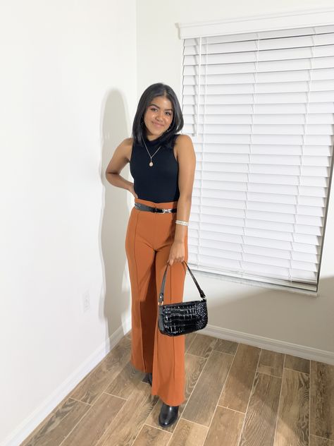 Burnt Orange Leather Pants Outfit, Orange Work Pants Outfit, Burnt Orange And Black Outfit, Burnt Orange Wide Leg Pants Outfit, Burnt Orange Trousers Outfit, Orange And Black Outfit Aesthetic, Ulta Work Outfit, Orange Wide Leg Pants Outfit, Orange Pants Outfit Work