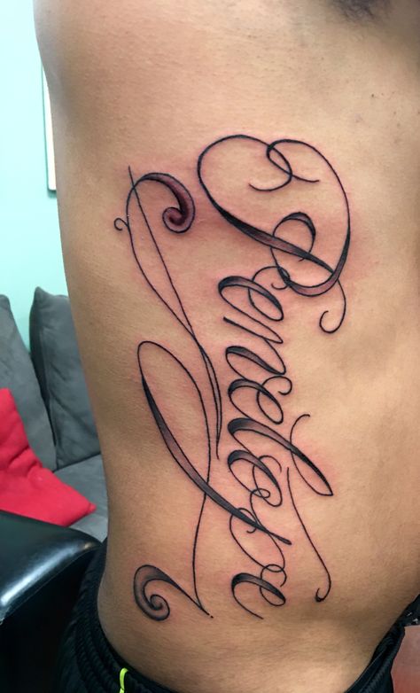 Rib cage name tattoo done at Eazy Street Tattoos located on 13433 SW 56th St Miami, FL  33175 by artist Tony #ribcage #ribcagetattoo #tattoo #big #name #letters Name Tattoos On Ribs, Big Name Tattoos, Street Tattoos, Tattoos For Females, Baby Name Tattoos, Names Tattoos For Men, Ribcage Tattoo, Tattoo Inspiration Men, Writing Tattoos