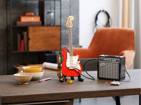 A LEGO Fender Stratocaster Guitar With an Amp, Tuning Pegs, a Pickup Switch, and an Iconic Whammy Bar Fender Strat, Stratocaster Guitar, Lego Toys, Lego Models, Reveal Ideas, Fender Stratocaster, New Star Wars, Lego Ideas, Big Book