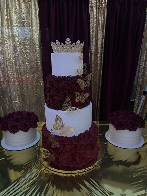 4 tier 15th Birthday cake with gold butterfly decor and a gold tiara Burgundy Quinceanera Theme, Red Quinceanera Theme, Red Quinceanera Ideas, Gold And White Cake, Burgundy Quinceanera Dresses, Quince Cakes, Quince Cake, Sweet 15 Party Ideas Quinceanera, Sweet 15 Party Ideas