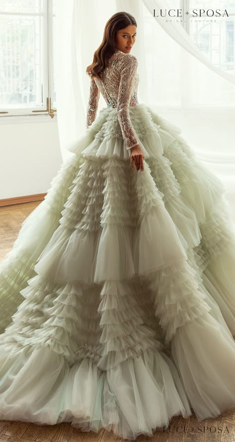 Long sleeves ball gown colored wedding dress with colorful pastel Crystal Embellishments on lace bodice and light green layered tulle skirt | Luce Sposa Wedding Dresses 2021- Abigail - Belle The Magazine #weddingdress #weddingdresses #bridalgown #bridal #bridalgowns #weddinggown #bridetobe #weddings #bride #dreamdress #bridalcollection #bridaldress #dress See more gorgeous bridal gowns by clicking on the photo Net Gown, Colored Wedding Dress, Green Wedding Dresses, Asian Wedding Dress, Fancy Gowns, Couture Wedding Dresses, Exquisite Gowns, Kids Gown, Dress Cake