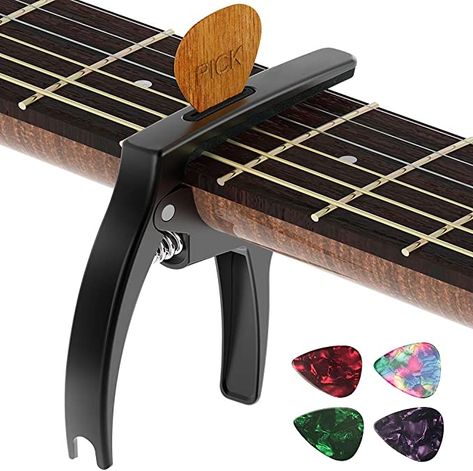 "Problem: My guitar playing lacked that extra edge. Solution: The TANMUS 3in1 Zinc Metal Capo! It gives my chords a fresh new perspective and keeps my picks within reach. Amazon, you've turned my musical journey into a cool adventure! https://amzn.to/3NOm3ss " Capo Guitar, Guitar Capo, Fingerstyle Guitar, Pick Holder, Guitar Center, Guitar Accessories, Guitar Strings, Acoustic Electric Guitar, Classical Guitar