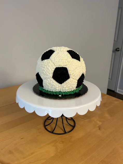 This is an all buttercream soccer ball smash cake for a 1st birthday party. I used the Wilton 6” Ball pan, but needed to create my own template to get the hexagons and pentagons the right size. Turned out super cute! Buttercream Soccer Cake, Soccer Smash Cake, Soccer Theme First Birthday, Soccer 1st Birthday Baby Boy, Soccer First Birthday Party, Ball Cakes For Boys, Soccer Cakes For Boys, Ball Smash Cake, Soccer Cake Ideas For Boys