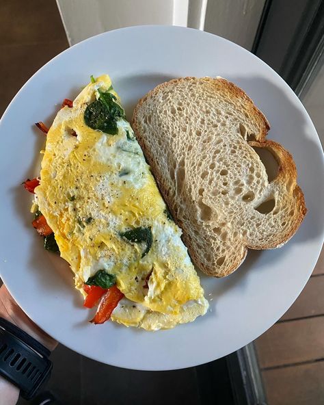 my breakfast ❤️ A fluffy omelet made with one whole egg, two egg whites, and a handful of spinach, filled with a creamy goat cheese spread (10ml whole milk, 25g goat cheese) and topped with roasted bell peppers. Served with a slice of sourdough on the side. 🤌 #breakfast #healthybreakfast #breakfastideas #omlet #highprotein #highproteinbreakfast #lifestyle #healthy #healthyfood #healthylifestyle #live #love #eggs #realfood #eatclean #lunch #healthyrecipes #delicious #yummy #gym #fit #motivat... Goat Cheese Spread, Field Meals, Roasted Bell Peppers, Veggie Omelet, Creamy Goat Cheese, Healthy Food Inspiration, My Breakfast, High Protein Breakfast, Cheese Spread