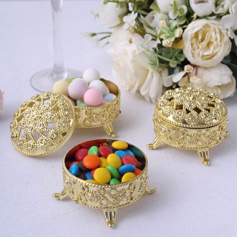 Find The Best Party Favor Gifts & Boxes At Efavormart. Choose From Vintage Trinket Boxes, Plastic Candy Containers, Gold Round Gift Boxes, & Other Designs! Gold Themed Gift Baskets, Gold Items For Gift Basket, Lilac Wedding Theme, Gold Favor Boxes, Peach Wedding Theme, Raspberry Wedding, Quince Decor, Round Gift Boxes, Favour Jars