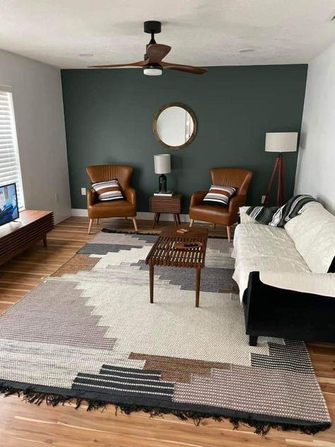 One Wall Accent Color Living Room, Dark Green Accent Wall Living Room Tv, Industrial Accent Wall Living Room, Green Black Accent Wall Living Room, Small Living Room With Accent Wall, Subtle Accent Wall Living Room, Living Room Accent Wall Green, Painted Accent Wall Behind Tv, Accent Wall Sitting Room