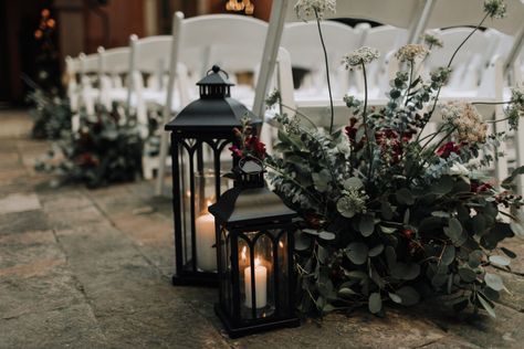 Aisle arrangements and decor at boho style Boojum Tree Arizona wedding with moody floral palette and greenery by Array Design, Phoenix, Arizona. Photographer: Alexandra Loraine Industrial Wedding Aisle Decor, Burgundy Wedding Aisle Decorations, Moody Wedding Flower Arch, Vintage Moody Wedding Decor, Winter Aisle Decor, Isle Lanterns Wedding, Moody Fall Wedding Ceremony, Moody Aisle Decor, Dark And Moody Wedding Ceremony Decor