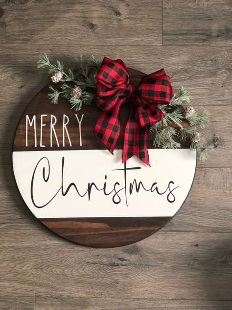 Double sided with fall on the back. Velcro bows. Christmas Wood Wreaths Diy, Diy Wooden Round Sign, Cricut Christmas Door Signs, Wood Board Signs Ideas, Round Wooden Christmas Door Signs, Wooden Round Signs Christmas, Circle Wood Signs Diy Christmas, Christmas Round Door Signs, Diy Christmas Door Sign