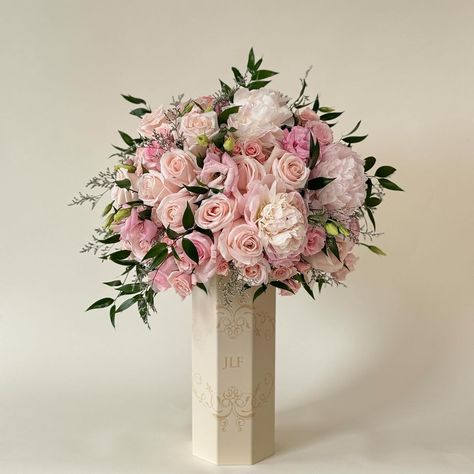 At JLF we developed the first-ever vase made from sustainable materials, meticulously designed to replicate our signature and iconic hat boxes. Shop the arrangements in the Vasè a Fleurs at www.jadorelesfleurs.com Blooming Bouquet Dior, Large Pink Flower Arrangements, Miss Dior Blooming Bouquet Gift Set, Pink And White Dried Flower Arrangements, Pink Flowers Vase Aesthetic, Hat Boxes, Sustainable Materials, Sustainability, Floral Arrangements